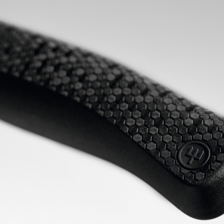 Detalle del mango Hexagon Power Grip de un cuchillo Wüsthof Performer, con textura de panal